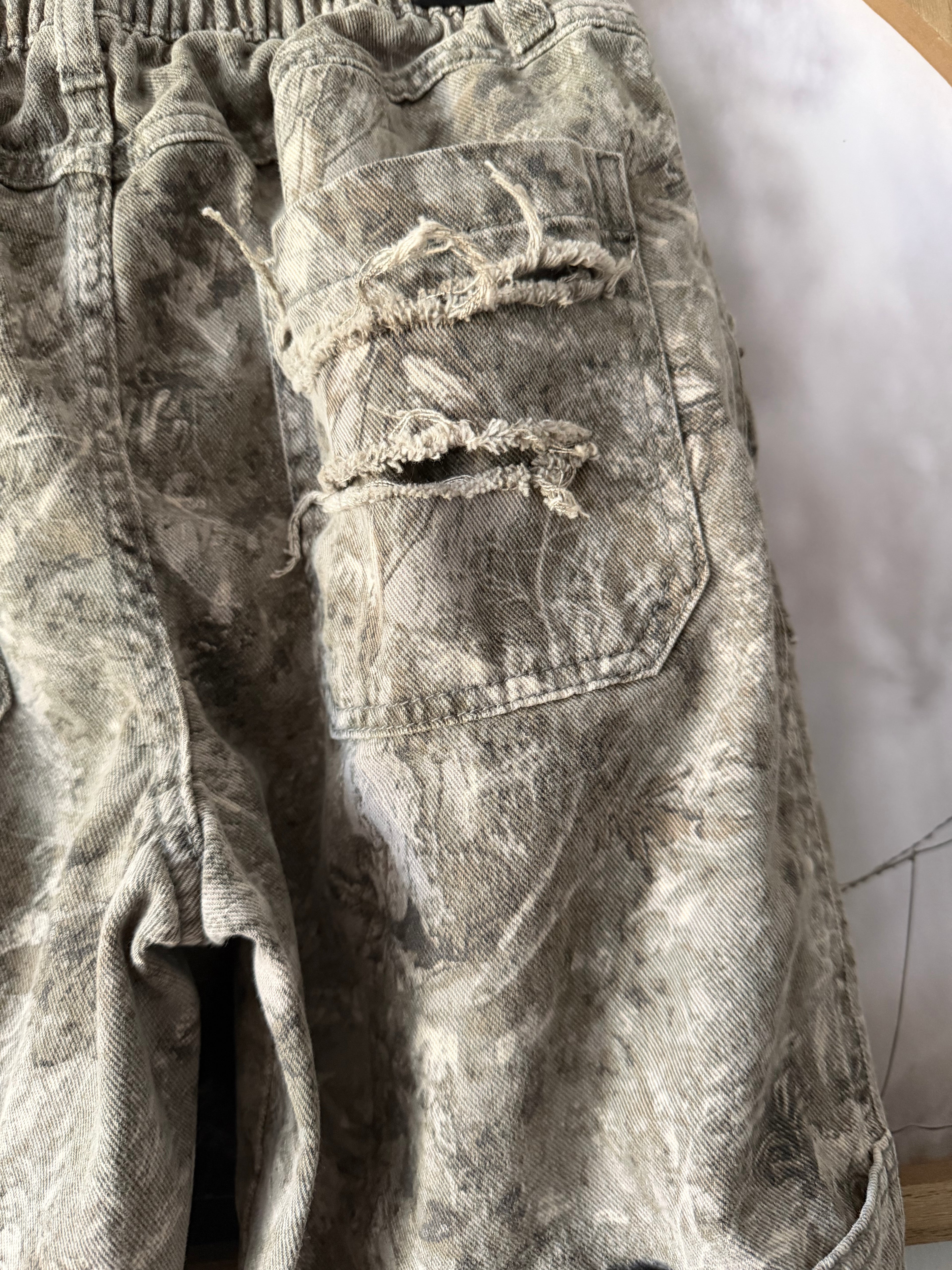 Revamped distressed camo denim 🚨