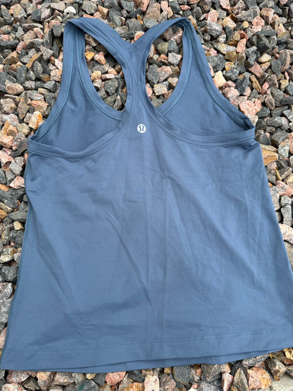 Lululemon racerback tank top in a dusty blue fits 2/4