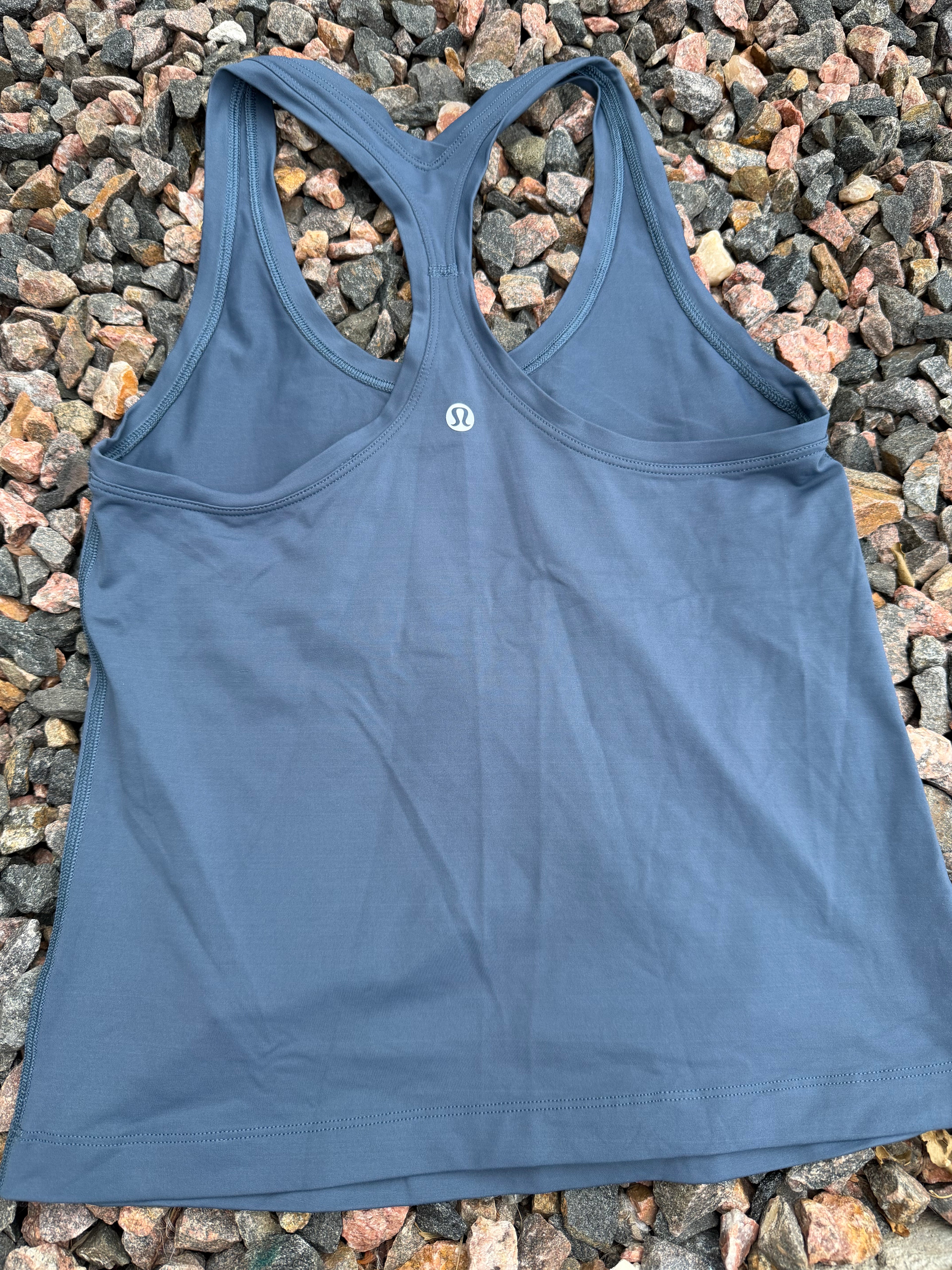 Lululemon racerback tank top in a dusty blue fits 2/4