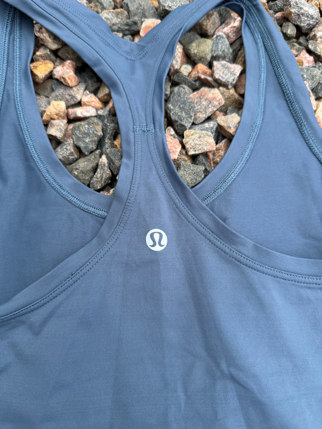 Lululemon racerback tank top in a dusty blue fits 2/4
