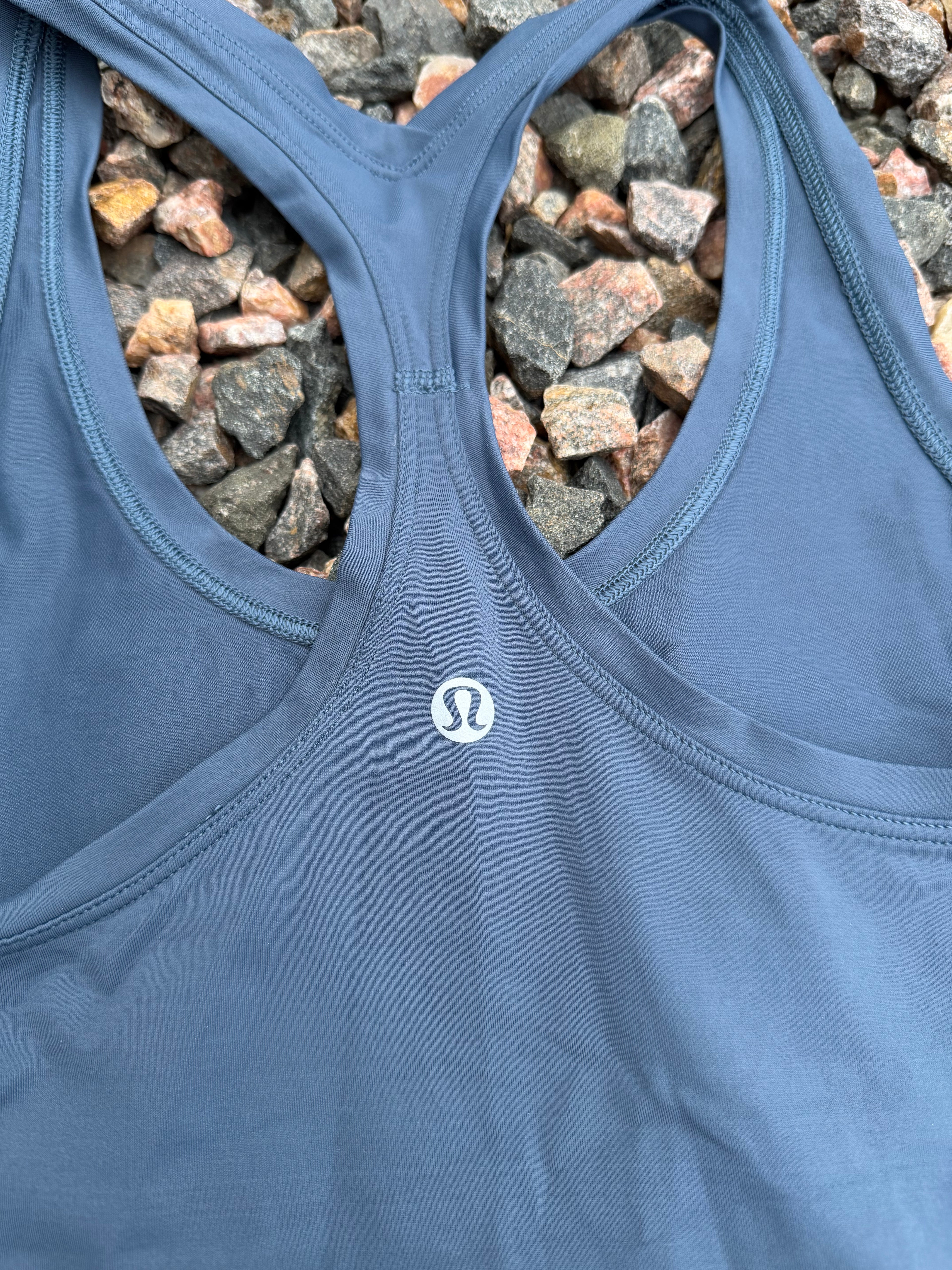 Lululemon racerback tank top in a dusty blue fits 2/4