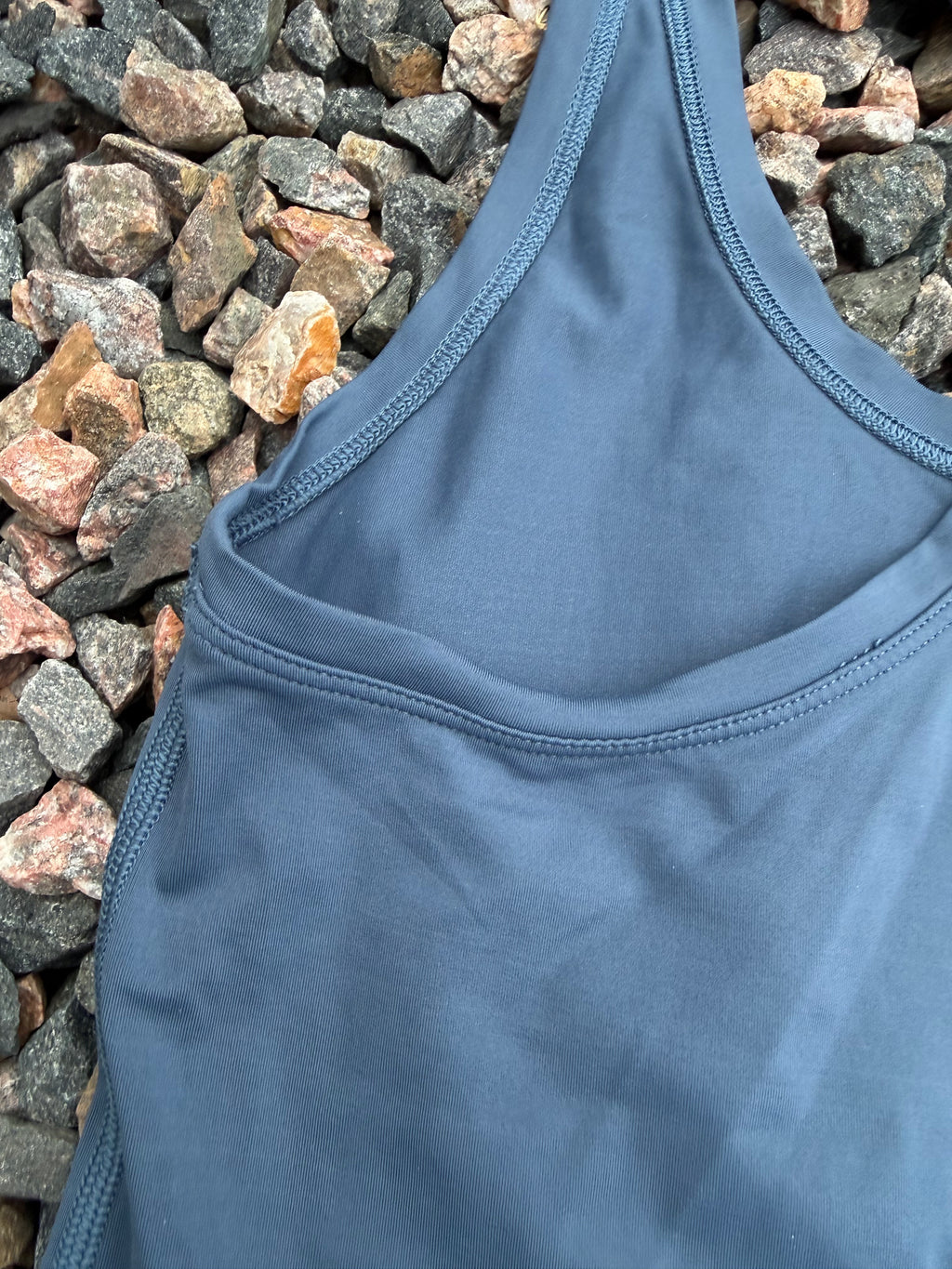 Lululemon racerback tank top in a dusty blue fits 2/4