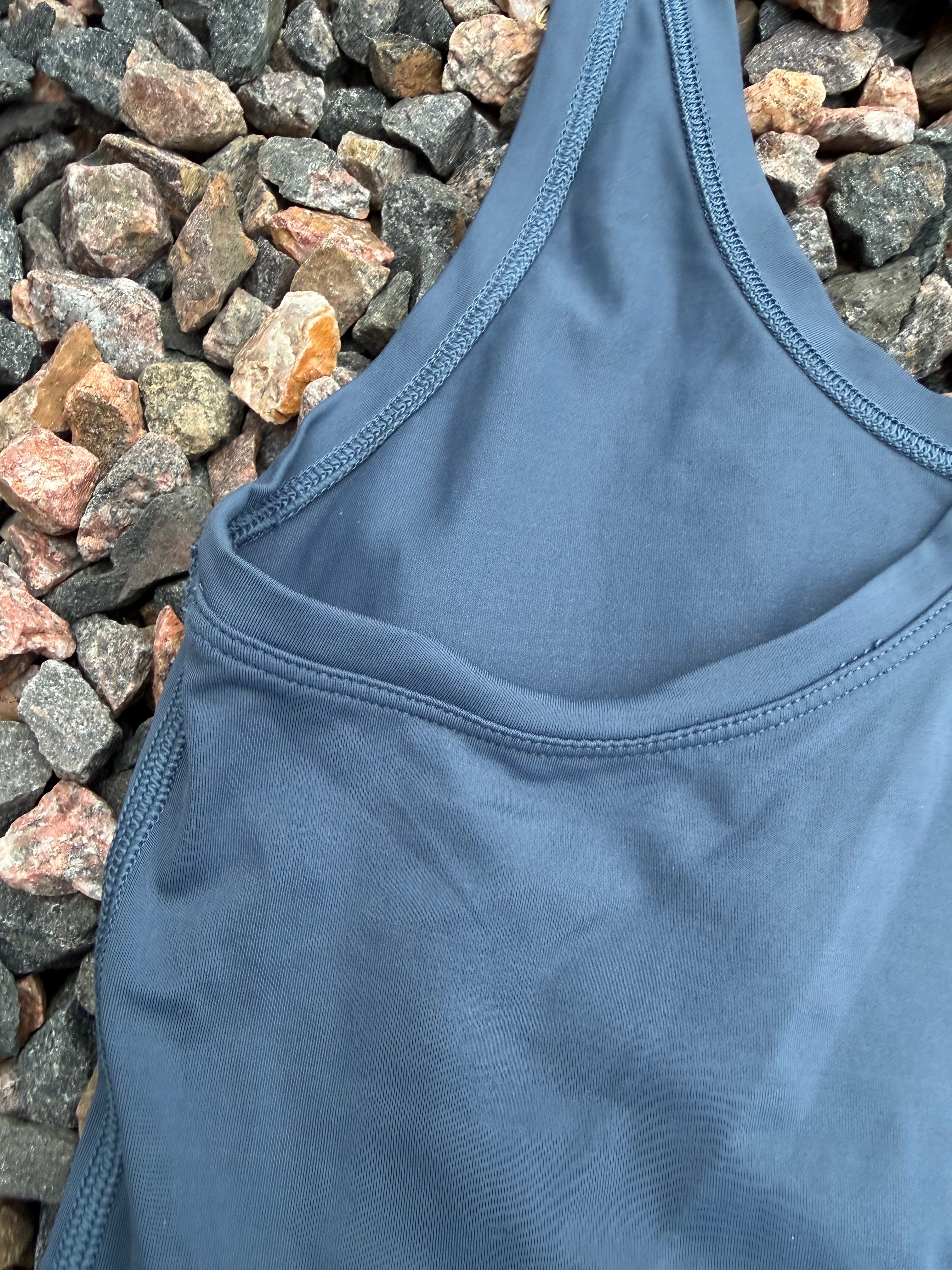 Lululemon racerback tank top in a dusty blue fits 2/4