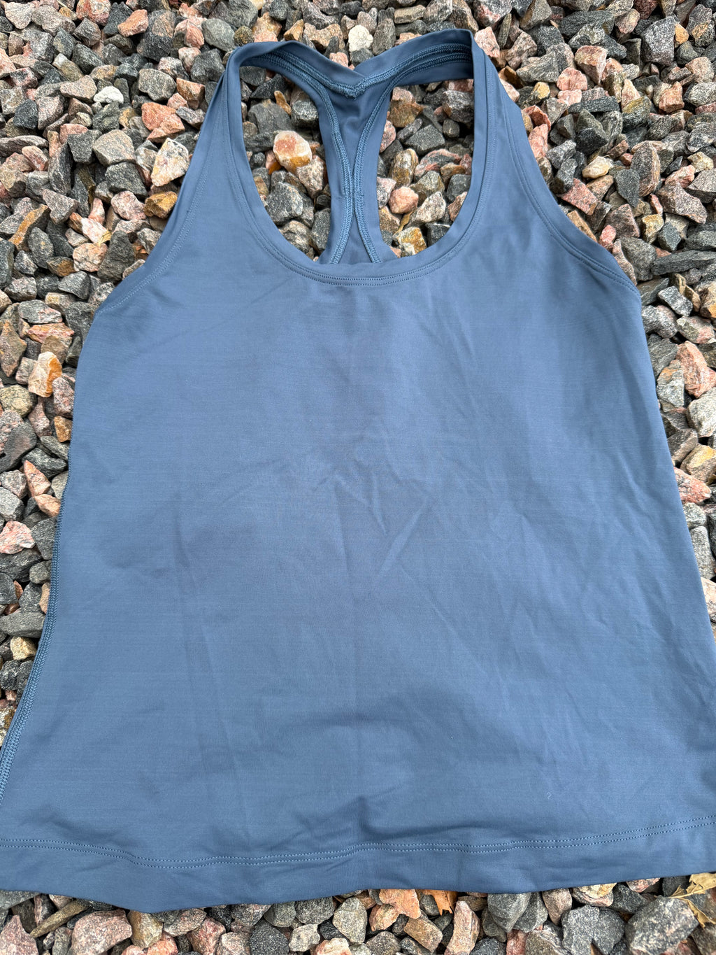Lululemon racerback tank top in a dusty blue fits 2/4